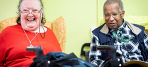 Two people over 55 enjoying a meeting